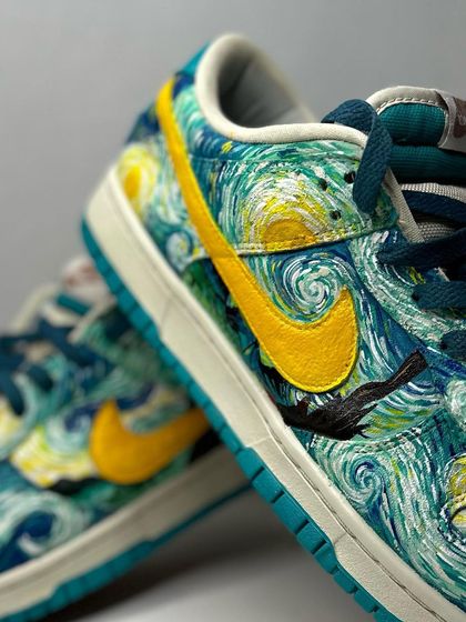 A close-up of the swoosh on the "Starry Night" custom, with the iconic cypress tree from the painting.