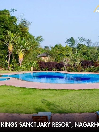 The inviting pool at JLR Kings Sanctuary Resort in Nagarhole, a perfect place to relax and unwind after an exciting jungle safari.