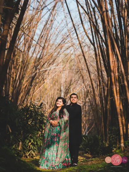 A portrait of Shivya and Vaibhav amidst a bamboo forest. The contrast between her floral outfit and the natural setting is just stunning.