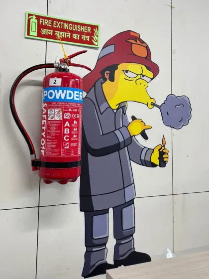 We used humor to make this fire extinguisher stand out. The cartoon mural not only draws attention to the safety equipment but also injects personality and fun into an otherwise standard factory corner.
