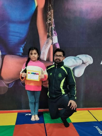 This student is happy to be recognized for her hard work with a new certificate.