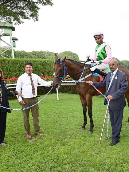 Miracle Star, with jockey Neeraj Rawal, is pictured with its owners after a splendid victory in The Bangalore Summer Million.