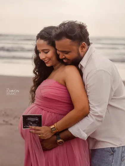 Sharing the first glimpse of their baby with a sonogram picture. This is such a special moment to capture during a maternity shoot, full of love and excitement.