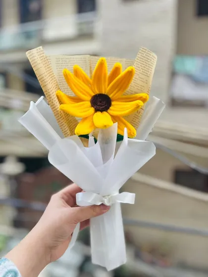 A single jumbo sunflower, beautifully wrapped like a professional bouquet. This makes a stunning and unique gift.