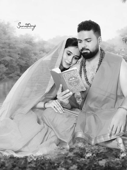 A quiet, intimate moment from the Ram-Sita inspired shoot. This black and white photo captures the couple reading together, focusing on their connection and the peacefulness of the scene.
