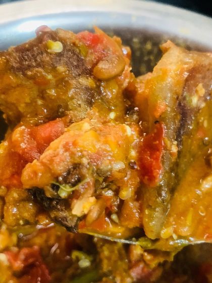 A spoonful of my smoked pork with Axone. It's spicy, pungent, and full of flavor from green chillies and ginger.