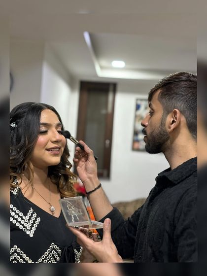 A behind-the-scenes moment, applying blush to my beautiful client. I love these candid shots that capture the process of creating a look.