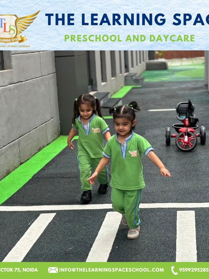 Two children walk across the zebra crossing in our traffic park. We use this dedicated space to teach important pedestrian safety rules in a hands-on, memorable way.