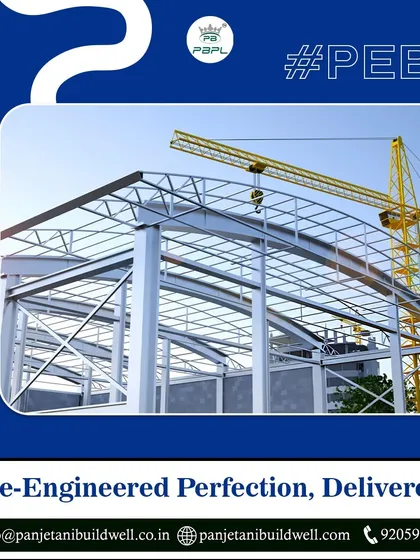 We deliver pre-engineered perfection. The clean lines and strong steel skeleton of this PEB structure, set against a clear sky, represent our commitment to quality and efficient construction.