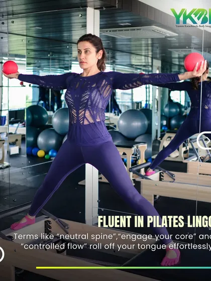 This client demonstrates beautiful form on the reformer. Mastering Pilates lingo like "neutral spine" and "controlled flow" is a sign you're truly connecting with the practice.