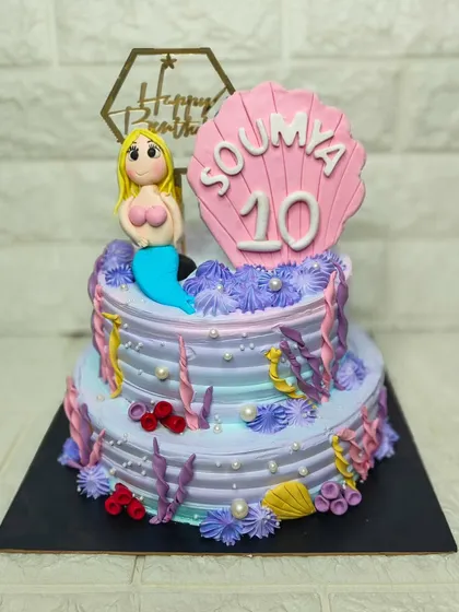 Under the sea! This beautiful two-tier mermaid cake was for a 10th birthday. I loved creating the pastel underwater world with hand-piped coral, pearls, and a fondant mermaid.