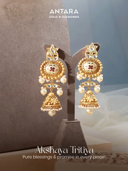 These jhumkas sway with the strength of tradition and the grace of modern elegance. Crafted with matte gold, enamel work, and pearls, they are a promise of pure blessings in every piece.