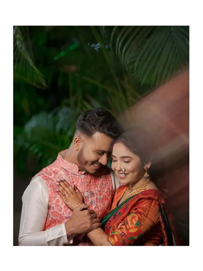 An artistic portrait with a light-streak effect, capturing a tender moment between the engaged couple.