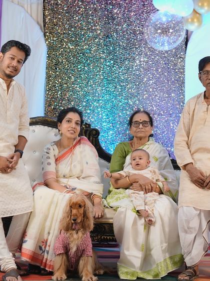 Another beautiful family photo from the rice ceremony, capturing three generations celebrating together.