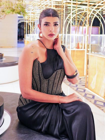 Lakshmi Manchu at the SIIMA awards in our Nexus ensemble. The look features a satin pre-stitched sari finished with a sculpted blouse and asymmetrical corset belt in zari threadwork.