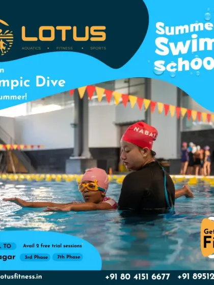 One-on-one attention is key to a child's progress. Here, a coach guides a young swimmer through a backstroke drill, providing hands-on support to help her master the technique.