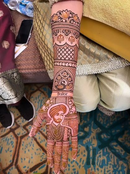 A detailed portrait of the groom in his wedding turban, personalized with his name, Rishabh. This is a great example of a groom-centric design element.