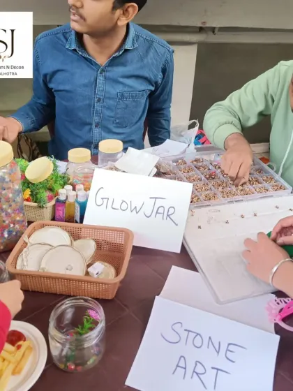 Our activity corner featuring a Glow Jar workshop and Stone Art station. We provide multiple creative options to cater to different interests and age groups.