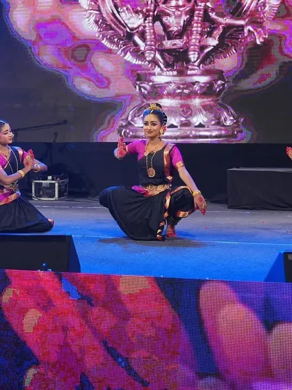 A serene moment from the 'Ayyappa Kavuthuvam', where dancers are in a pose of reverence, showcasing the devotional aspect of our performances.