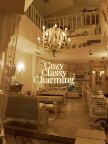 Cozy, classy, and charming. This wide view showcases the different seating arrangements and the airy, open feel of the bistro, all under the soft light of our beautiful chandeliers.