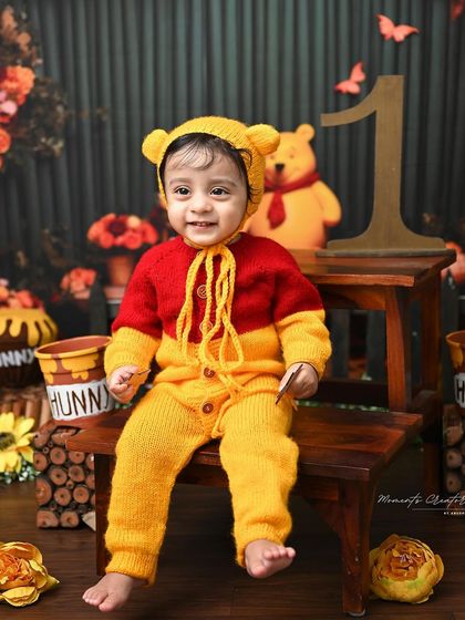 A happy smile from the cutest bear in the woods. This close-up shot perfectly captures the joy of this little one during his Winnie the Pooh themed session.