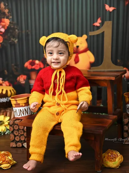 A happy smile from the cutest bear in the woods. This close-up shot perfectly captures the joy of this little one during his Winnie the Pooh themed session.