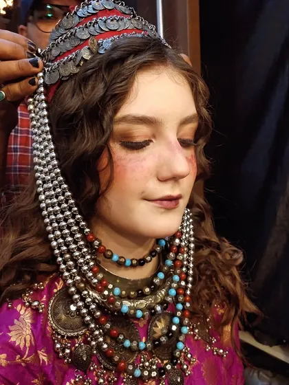 Final touches on a traditional, rustic-themed look. I created a flushed, sun-kissed effect on the cheeks and nose, adding freckles to complete the character makeup.
