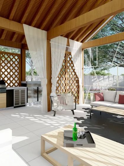 A 3D render of a gazebo concept where wooden elegance meets the soft embrace of white sheers. The open structure includes a full outdoor kitchen, designed for intimate coziness and entertaining.
