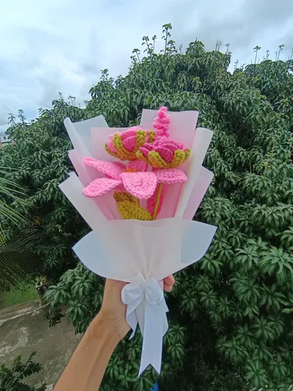 A custom bouquet with pink lilies and lavender.