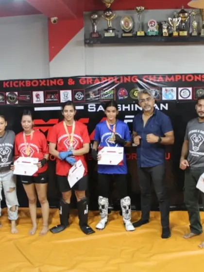 Our team of coaches and victorious female fighters at the Open Club Kickboxing & Grappling Championship. Their medals are a direct result of their dedication and rigorous training.