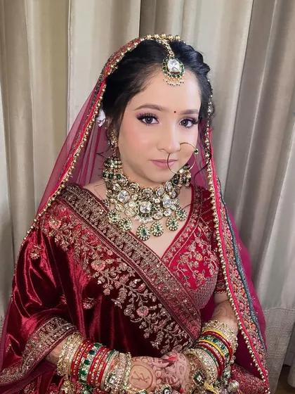 My bride Komal, looking absolutely radiant. I used soft purple and pink tones on her eyes to complement her beautiful velvet lehenga.