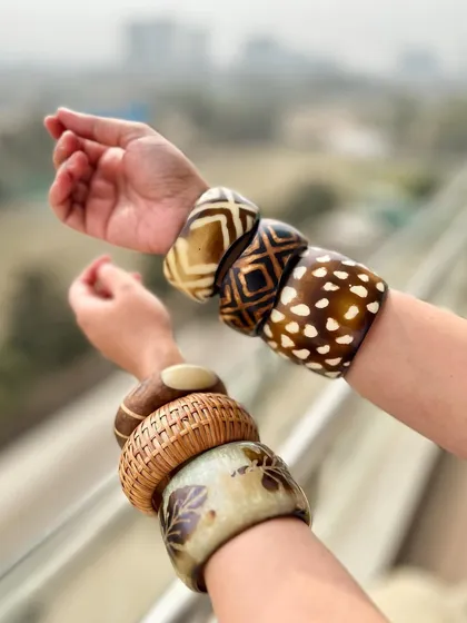 The bangle stacks against a city backdrop. It shows how you can bring a bohemian vibe to an urban setting.