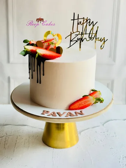 Sometimes, simple elegance is the most delicious statement. This classic vanilla cake is finished with a smooth whipped cream frosting, a rich chocolate drip, and topped with fresh, juicy strawberries for a timeless look and taste.