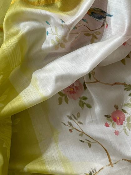 A close-up of the hand-painted dupatta, revealing the delicate brushstrokes and charming details of the floral and bird motifs.