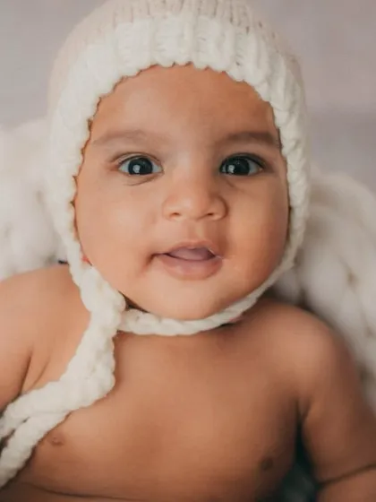 Those big, curious eyes are captivating. Close-up shots like this are perfect for capturing your baby's developing personality.