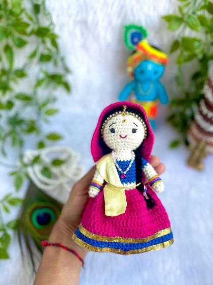 The divine couple, Radha and Krishna. I made this beautiful pair to celebrate the festival of Holi. Radha's lehenga and Krishna's turban are crafted with bright, festive colors.