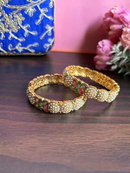 A pair of our beautiful pearl and stone bangles, perfect for stacking or wearing on their own.