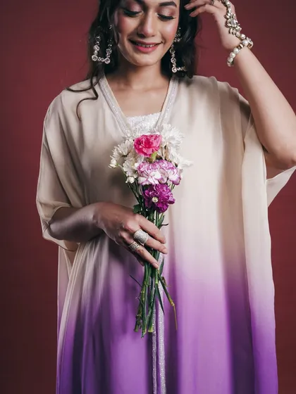 This is a tighter, mid-shot from the same lookbook, bringing attention to the outfit's details and the model's accessories. It provides a closer look at the fabric's gradient and the delicate pearl earrings.