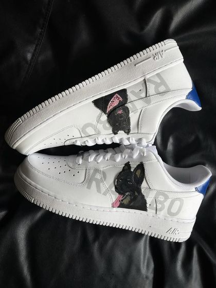 A pair shot of the Rambo custom sneakers, showing two different portraits of the same dog.