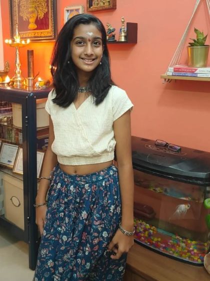 Here is a beautiful example of how my clothes grow with your child. This young lady is wearing our floral skirt with a simple white top, showing how versatile these pieces can be.