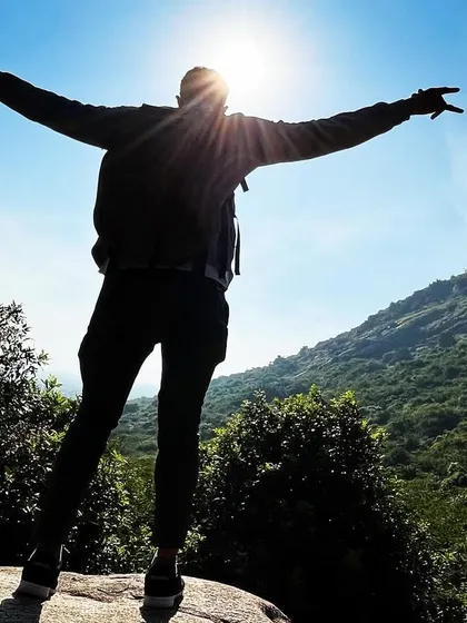 That feeling of reaching the peak just as the sun breaks through. This moment from our Skandagiri trek captures the pure joy and accomplishment that comes with an early morning climb.
