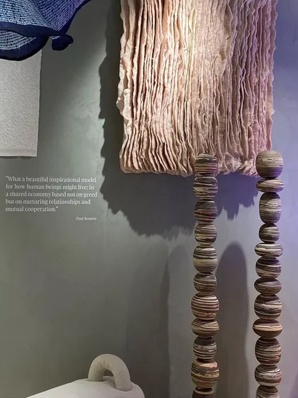 A curated display for our 'Shroom' installation, inspired by the world of fungi. The scene includes textile art with organic textures and sculptural objects that hint at the strange beauty of the mycelic world.
