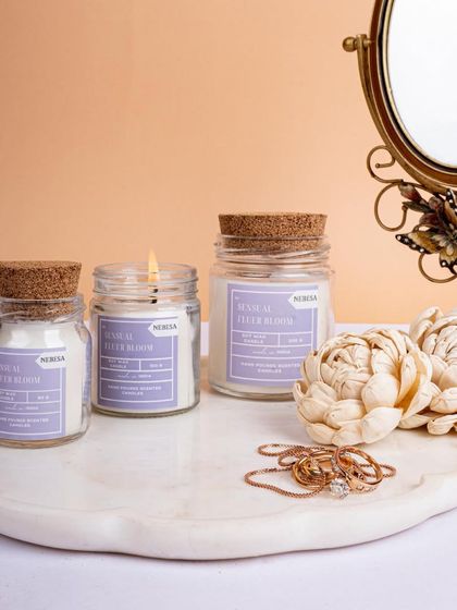 My "Sensual Fleur Bloom" candles are perfect for adding a touch of elegance to your vanity or dressing table. The delicate floral scent and beautiful jar make it a lovely decorative piece.
