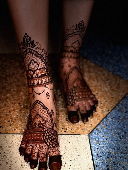 A beautiful bridal leg design with lotus and elephant motifs, creating a traditional and auspicious look.