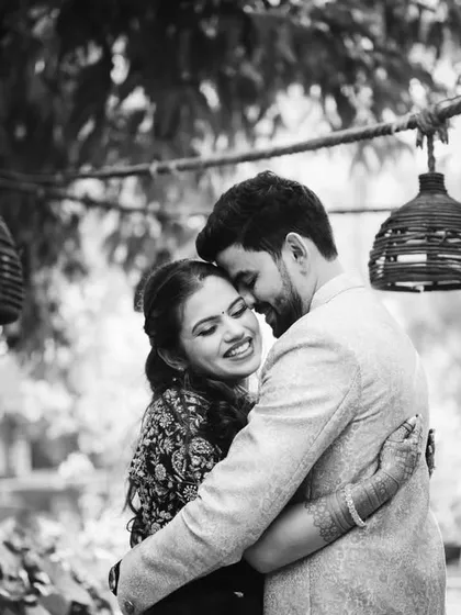 A classic, romantic black and white portrait from Sanika and Amol's backyard engagement shoot. The soft light and their embrace make this a timeless shot.