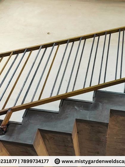 A detailed shot of the simple yet effective railing design. The focus here is on strength and durability, providing a safe barrier without obstructing the view.