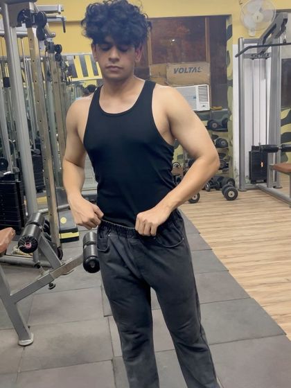 The "after" shot. This client now has a lean, athletic build with visible muscle definition after completing his transformation program.