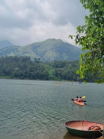 Kayaking on a serene lake in Wayanad. We offer various water activities as part of our itinerary.
