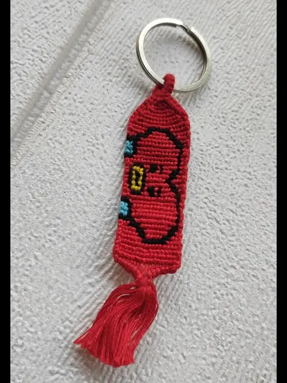 For the BTS ARMY, here is a BT21 Tata keychain. This knotted charm captures V's adorable heart-headed character perfectly.