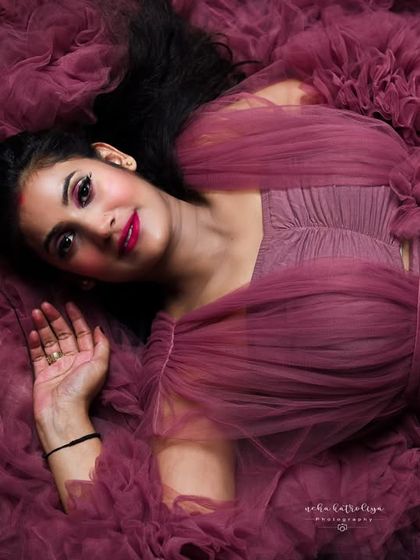 Lying in a bed of ruffled tulle, this overhead shot is pure art. It creates a soft, dreamy texture that is both unique and incredibly beautiful.